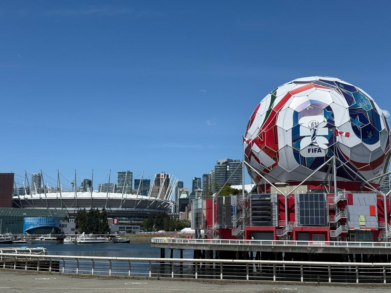 gallery-2 Iconic FIFA soccer ball and Vancouver stadium, showcasing urban sports architecture.
